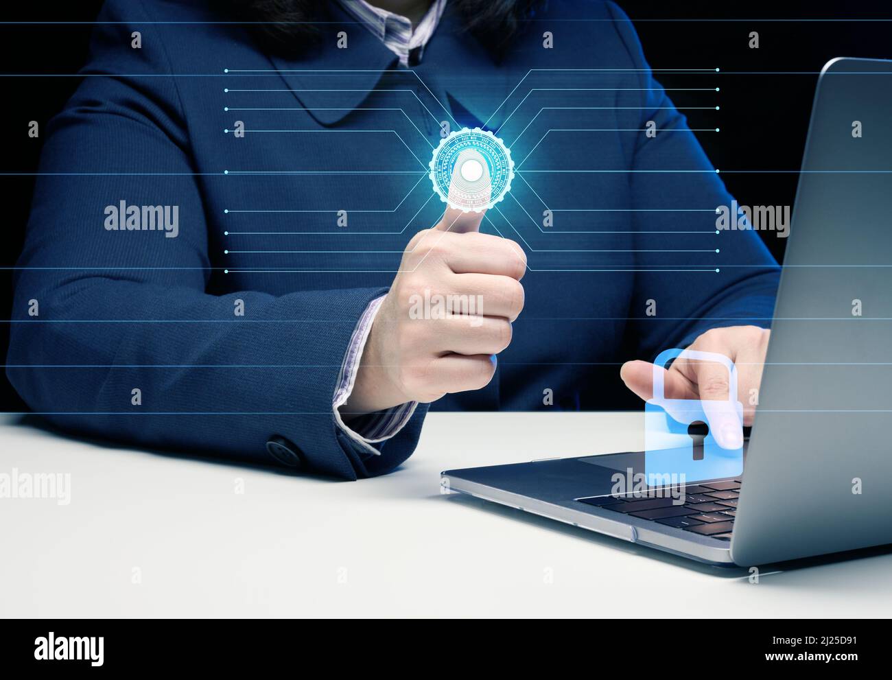 a woman sits at a table and works at a laptop. The hand presses a virtual button to scan the fingerprint. The concept of personal data protection Stock Photo
