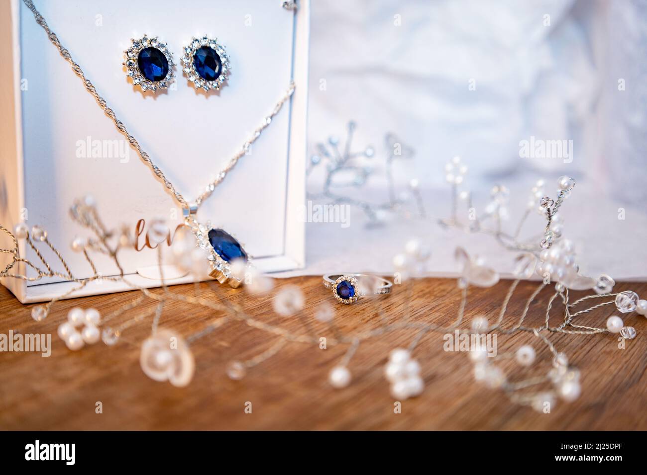 Wedding jewellery on wooden table. Stock Photo