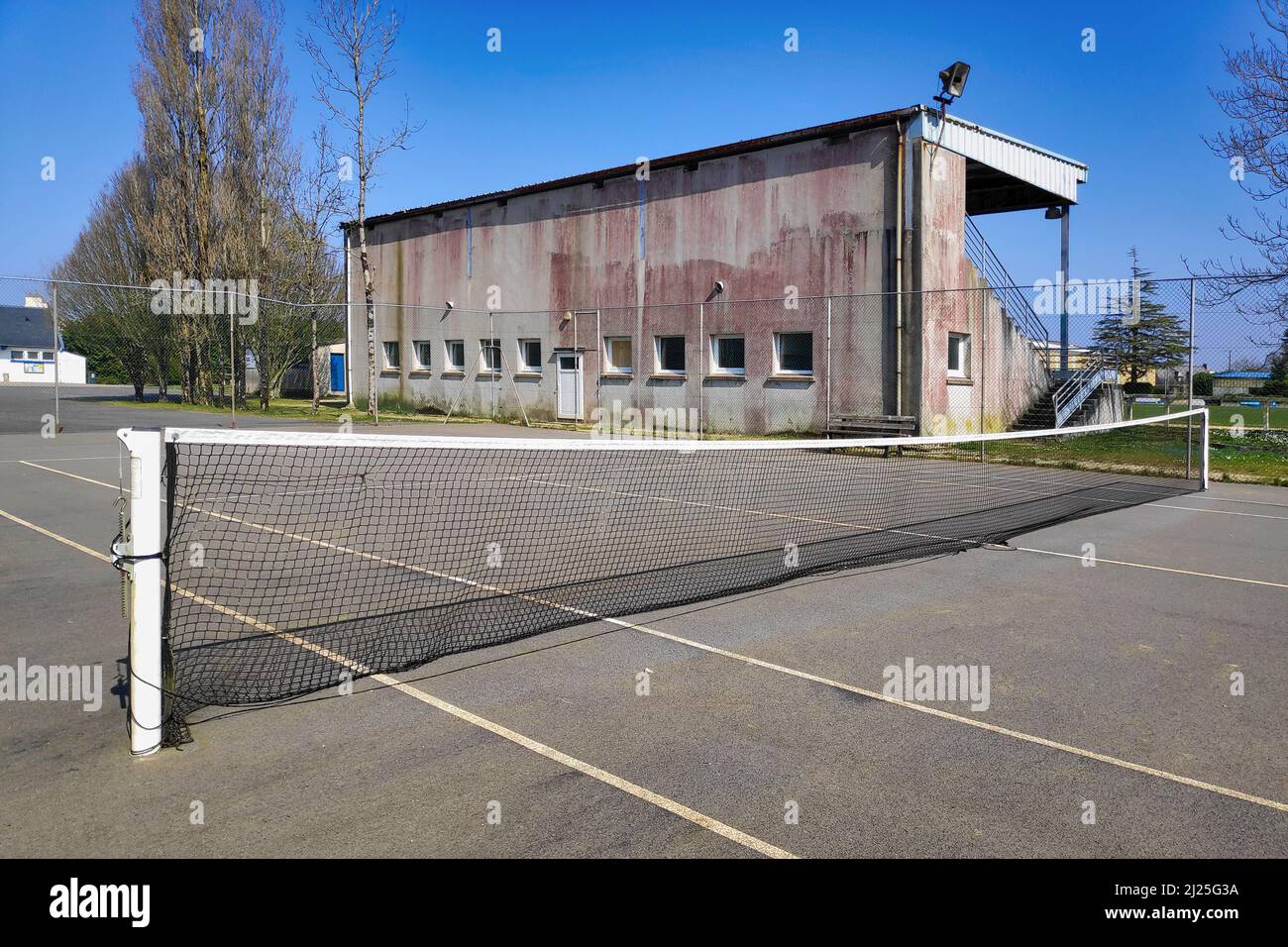 Empty black tennis hard court. Stock Photo
