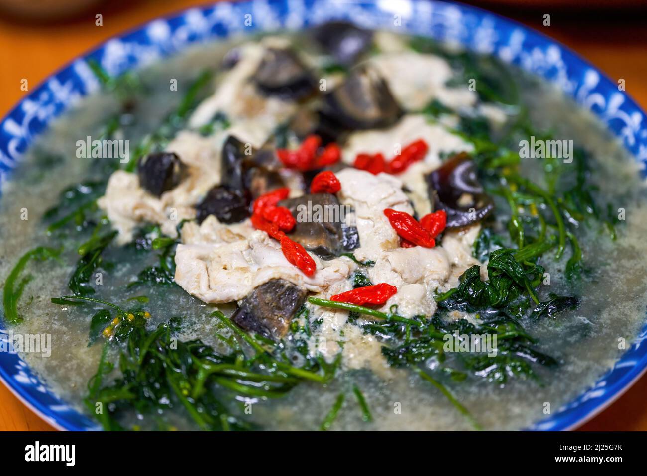 A Chinese homecooked dish with wolfberry leaves in soup Stock Photo