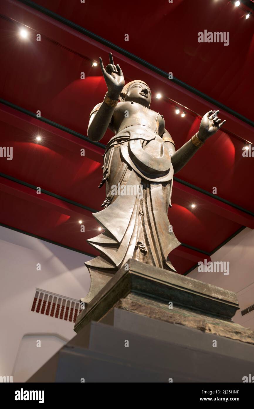 Standing statue of Buddha with the karana mudra, National Museum, Bangkok, Thailand Stock Photo
