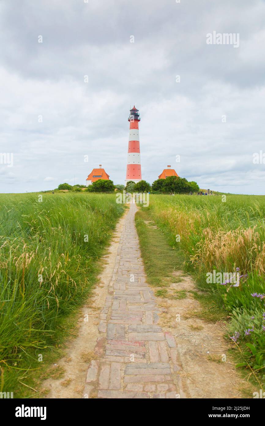 Path to Westerhever lighthouse. Wadden Sea National Park, North Frisia, Schleswig-Holstein, Germany Stock Photo