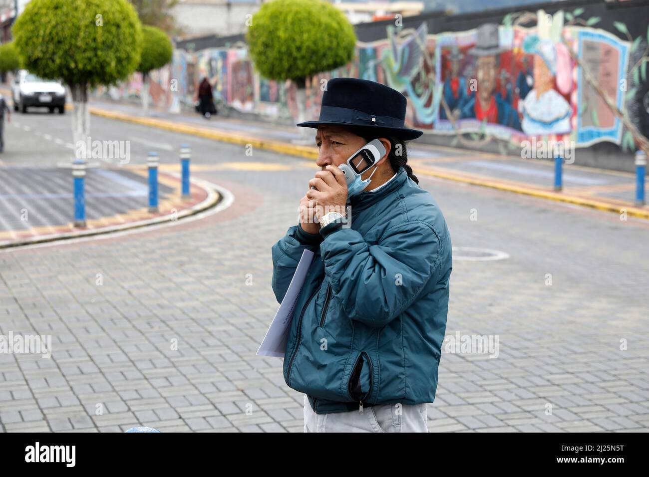 Indigenous Ecuadorian using a cell phone in Otavalo, Ecuador Stock