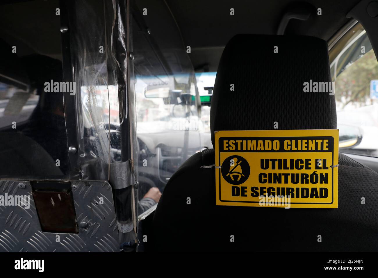 Sign in a taxi in Quito, Ecuador Use your safety belt Stock Photo Alamy