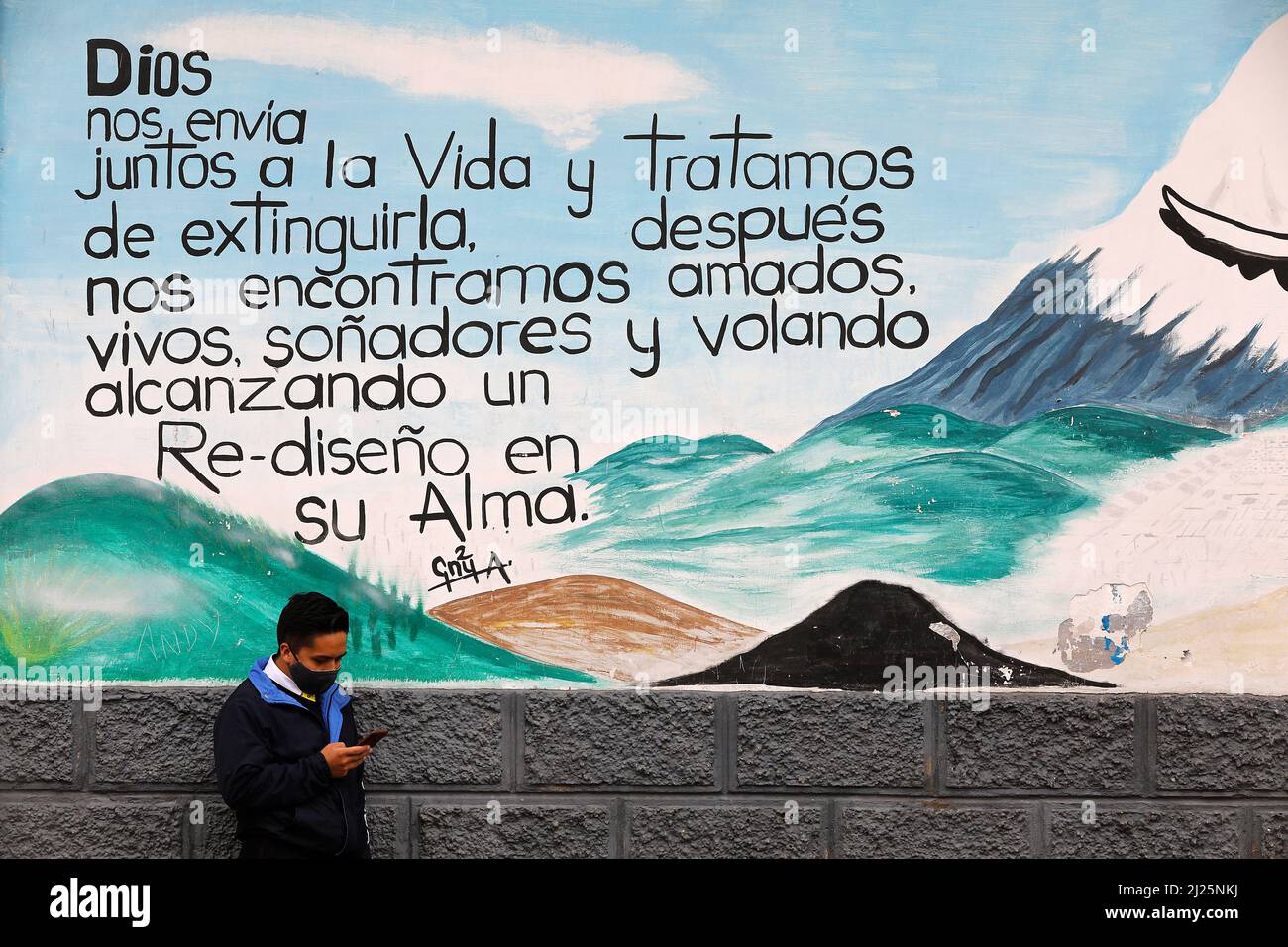 Man standing against a painted wall in Riobamba, Ecuador Stock Photo ...
