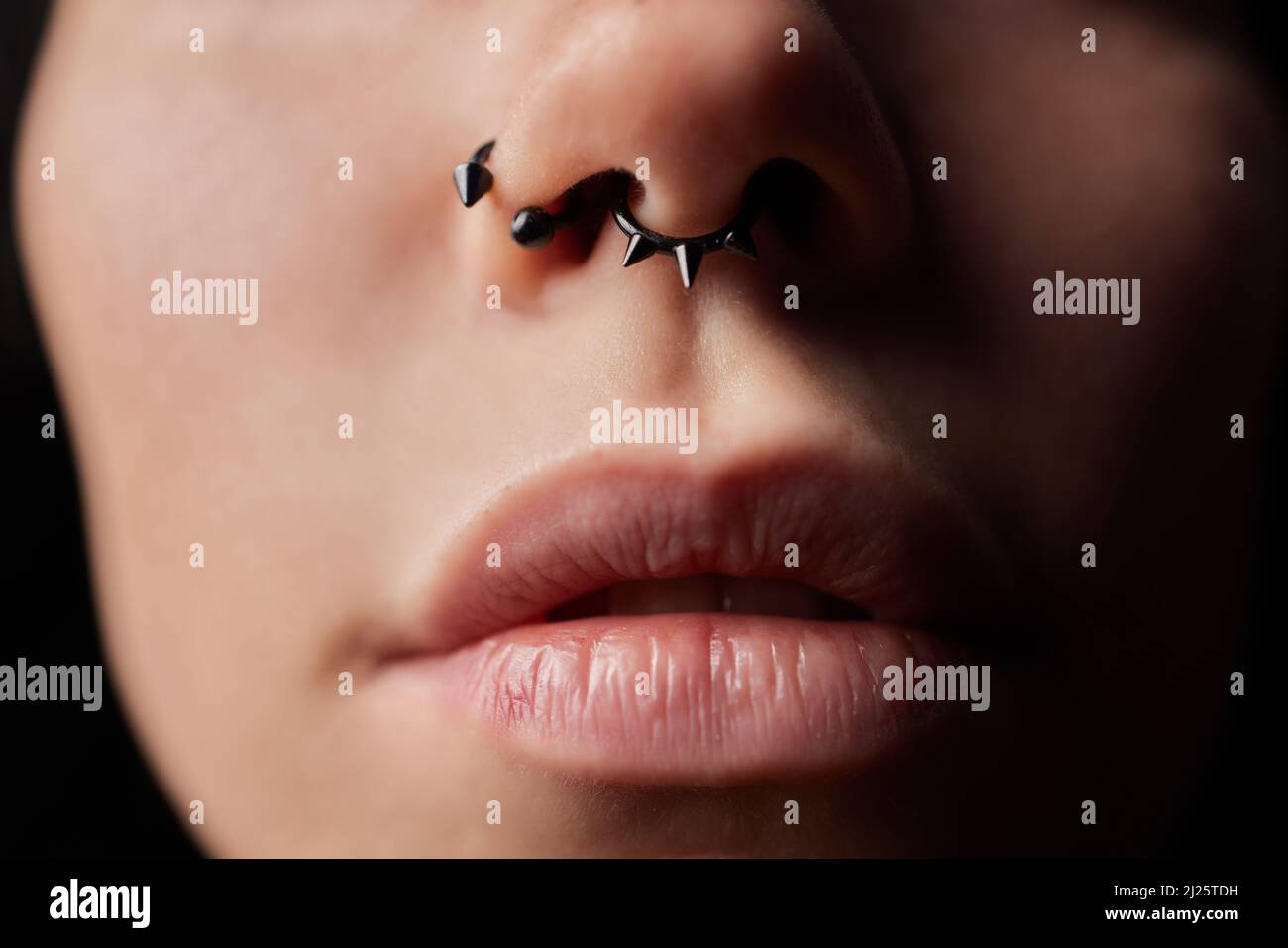 smile or frenulum piercing under the upper lip Stock Photo Alamy