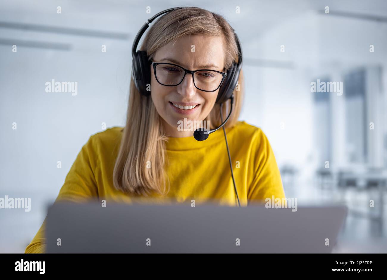 Woman working at call center Stock Photo