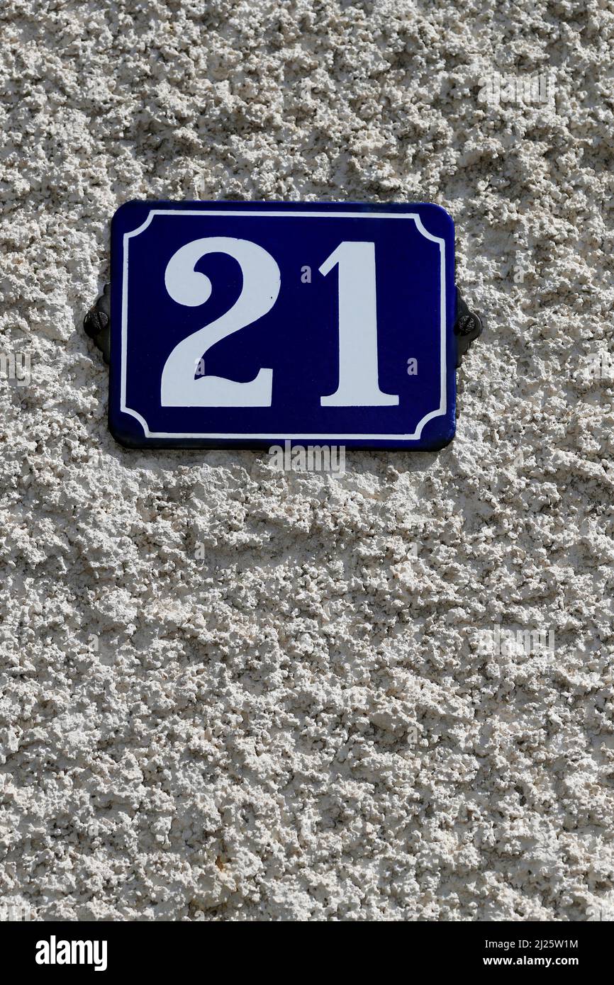 Number 21 on the wall of house. Adress. Stock Photo