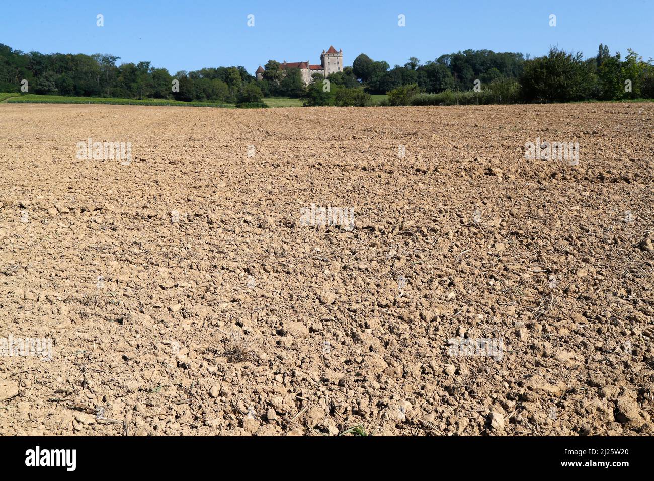 Lanscape in Jura with french old castle.  Field and agriculture. Stock Photo