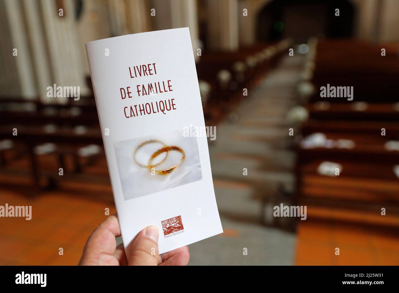 Wedding ceremony in a catholic church.  Catholic family register. Stock Photo