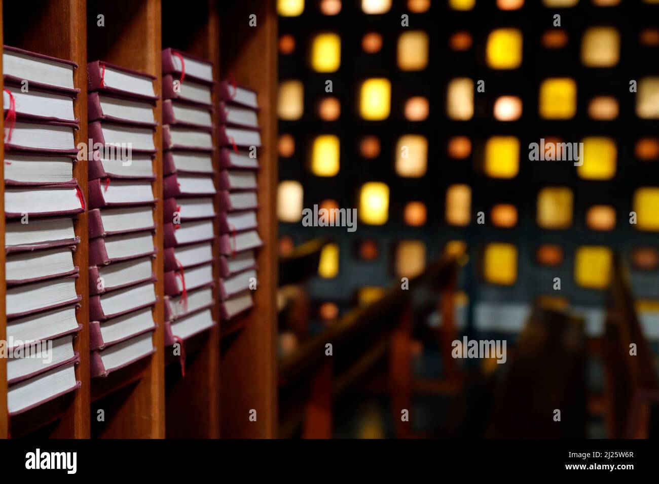 Sacred heart of Mosinges church. Songs book and stained glass window Stock Photo Alamy