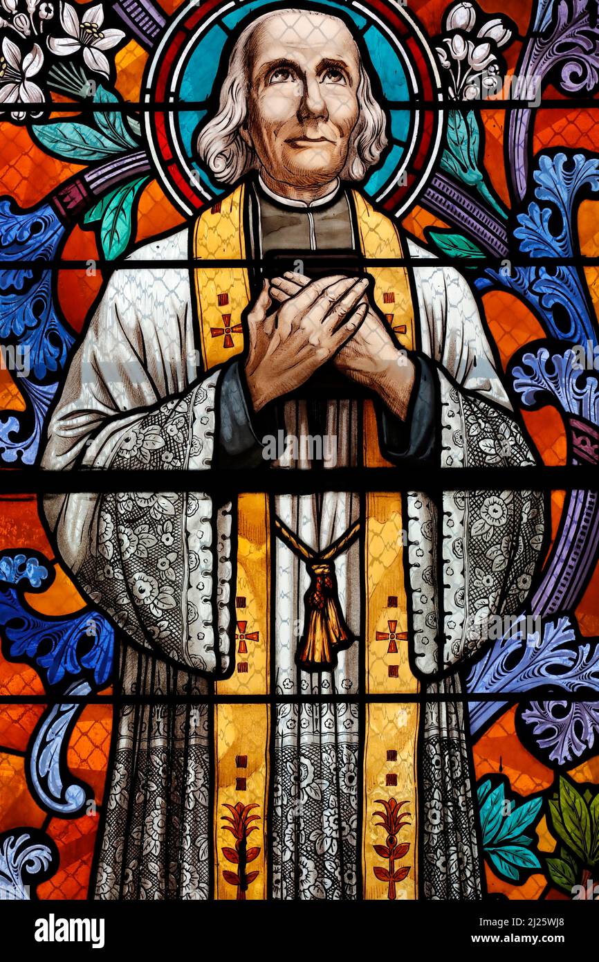 Saint Pothin church. Stained glass window. Saint John Vianney, was a