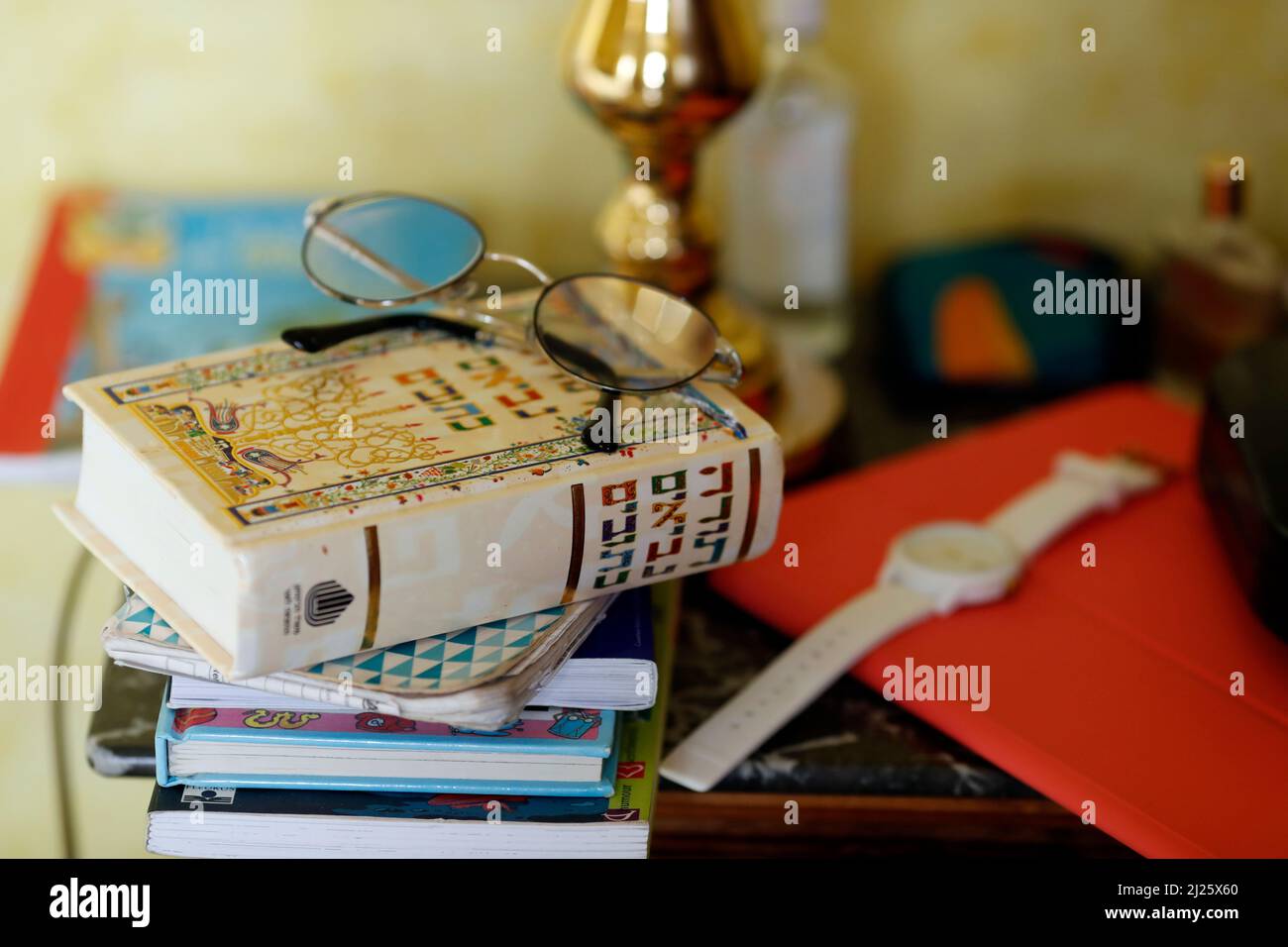 Religion at home. Hebrew Torah book on a bedside table beside a bed in