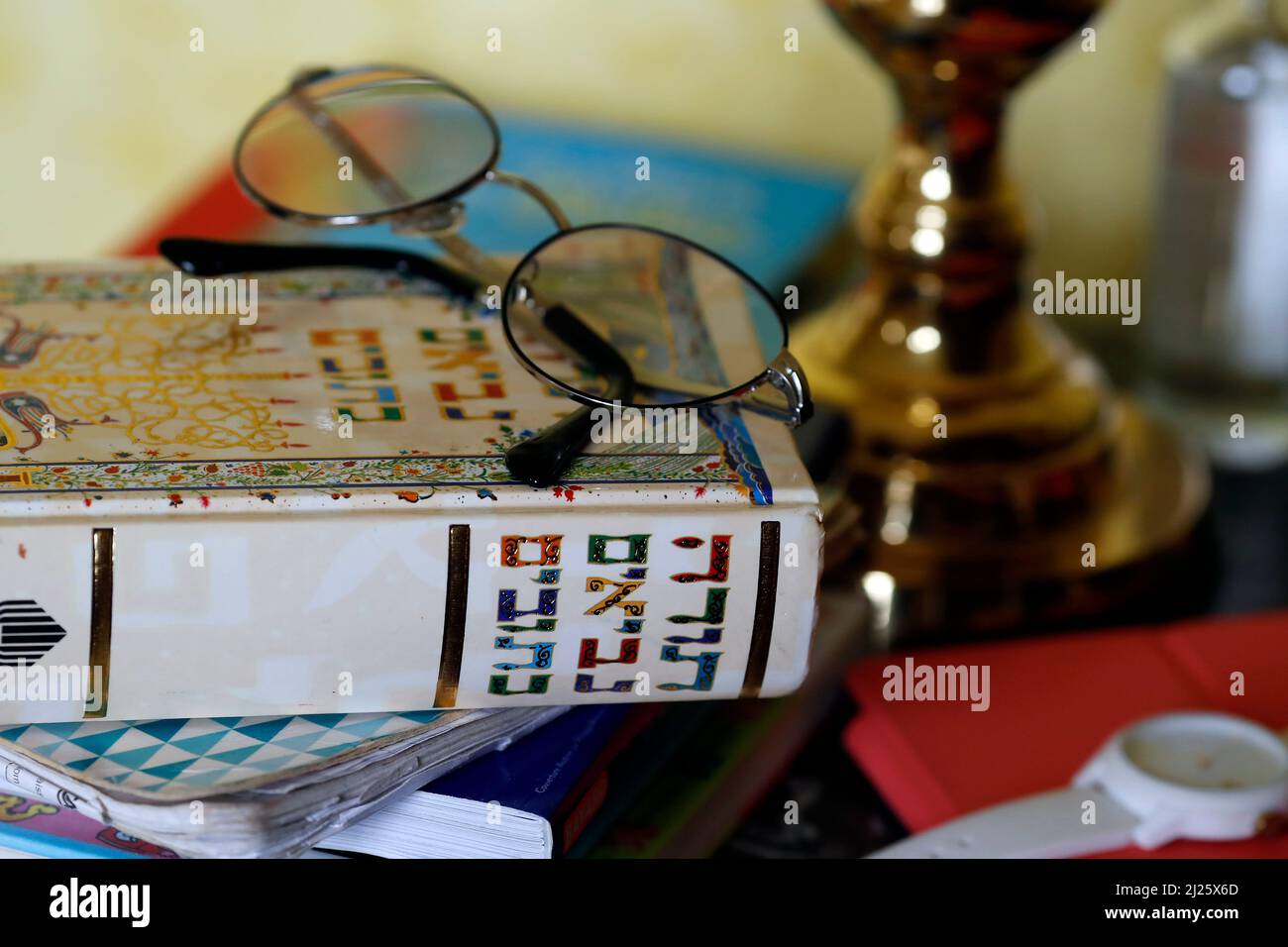 Religion at home. Hebrew Torah book on a bedside table beside a bed in