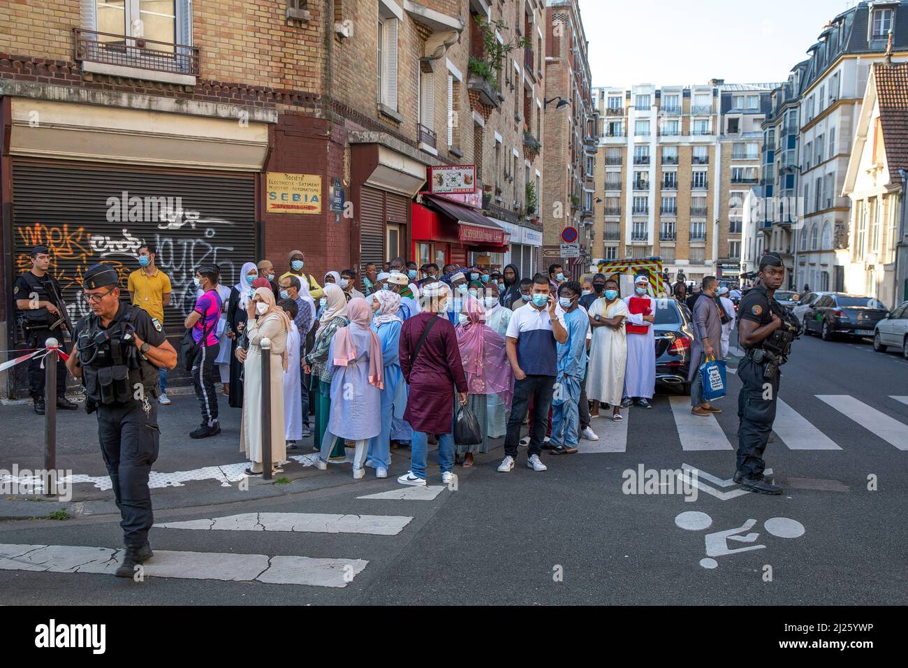Crowd of muslims waiting to be admitted in the Paris Great Mosque for Eid prayer, France Stock Photo