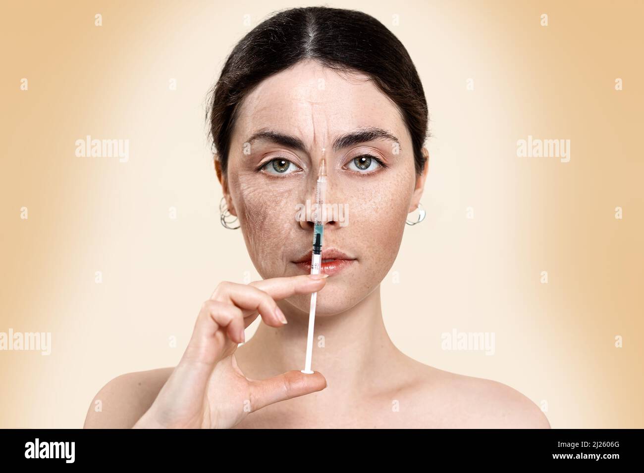 Portrait of a beautiful woman holding a syringe with an injection near the face, divided into two parts-young and old. The result before and after the Stock Photo