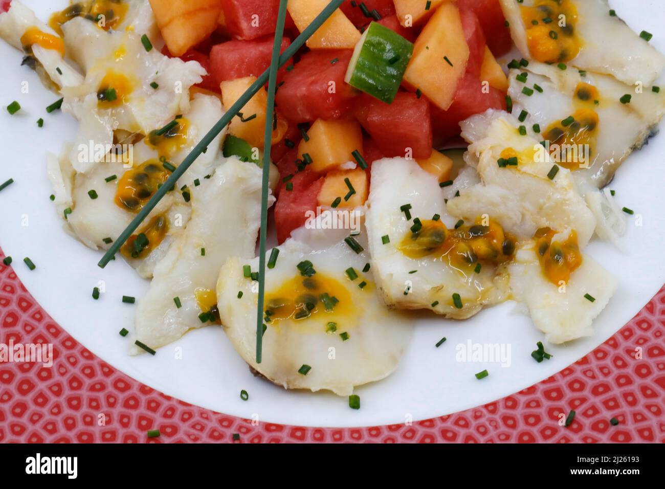 Asian kitchen. Scallops carpaccio with mango and passion fruits Stock Photo Alamy