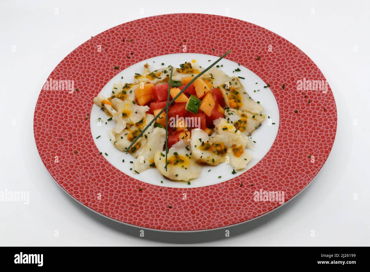 Asian kitchen. Scallops carpaccio with mango and passion fruits Stock Photo Alamy