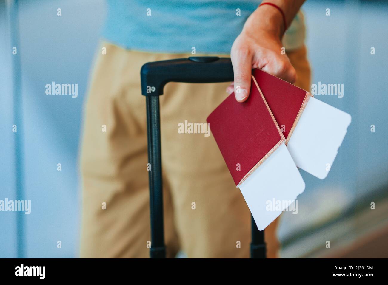 Passports and boarding pass in male hands at airport Stock Photo - Alamy
