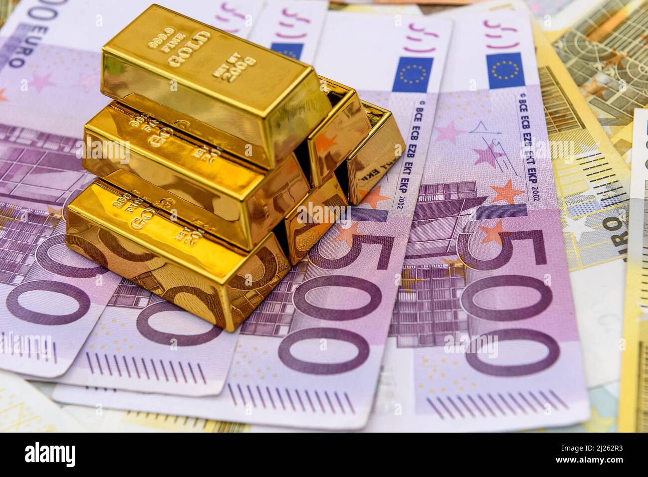 Pyramid of gold bullion on euro banknotes background Stock Photo