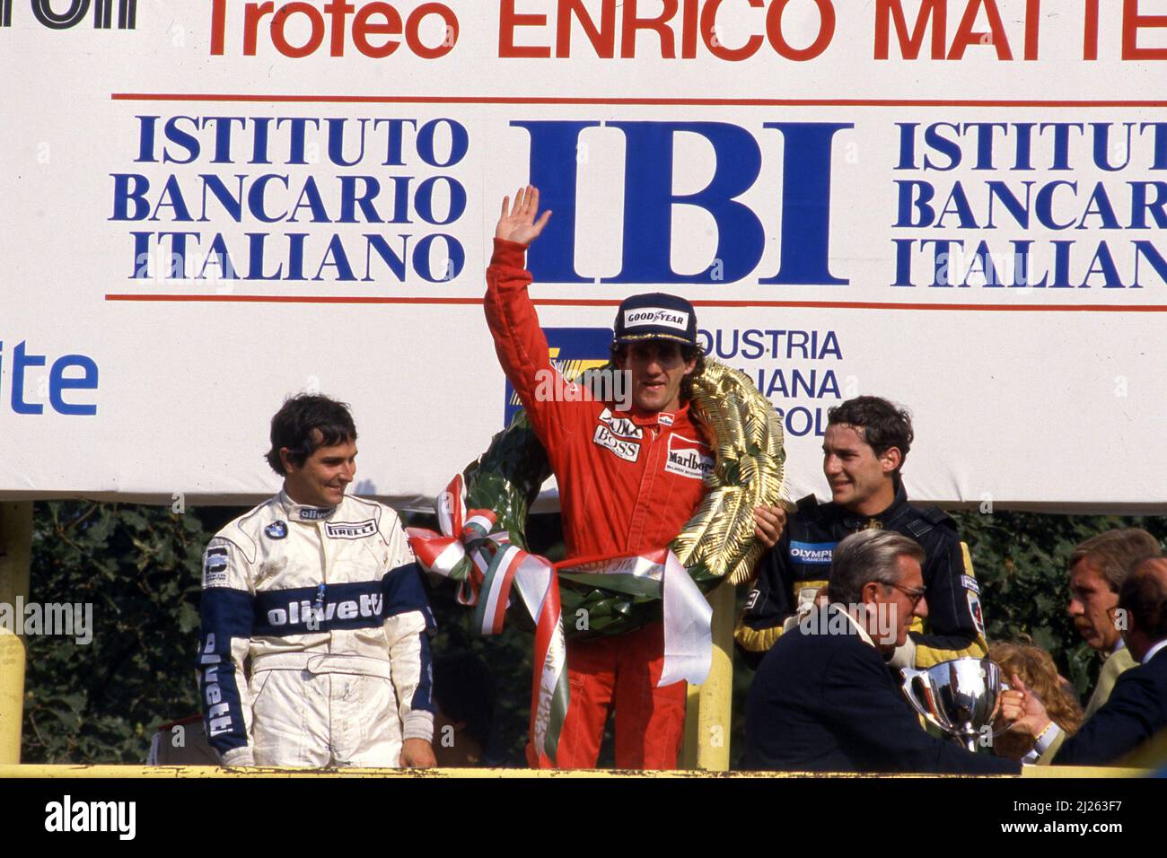 Nelson Piquet (BRA) Brabham 2nd position Alain Prost (FRA) McLaren 1st position Ayrton Senna da Silva (BRA) Lotus 3rd position celebrates podium Stock Photo