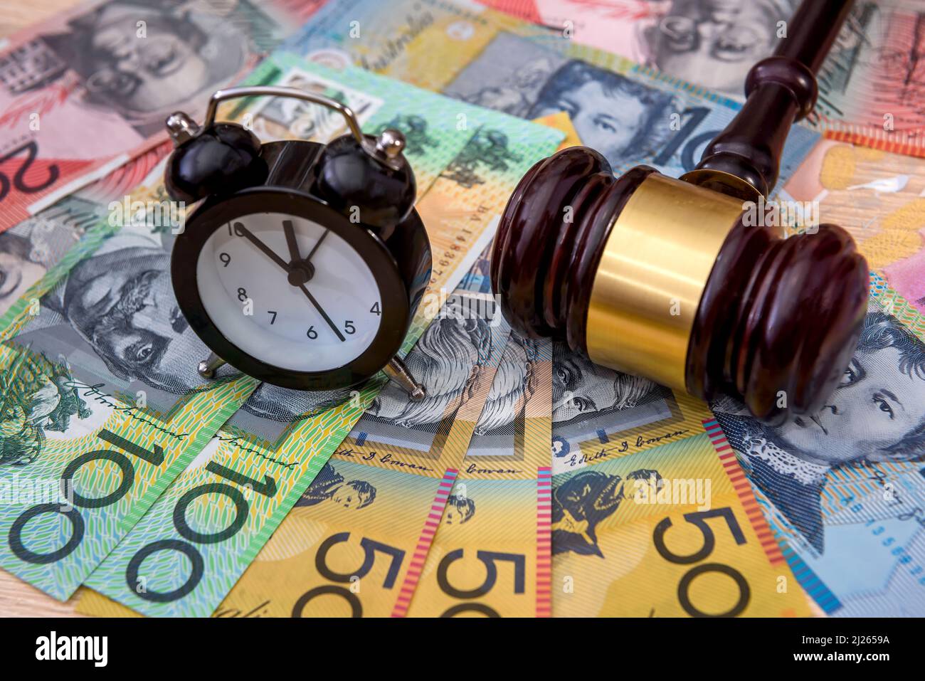 Australian dollars with wooden judge's gavel. Taxation company Stock Photo