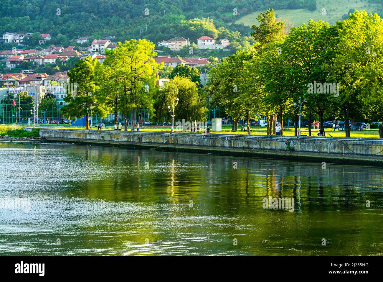 View of Danube river and Orsova city vegetation and buildings, waterfront view. Orsova, Romania, 2021 Stock Photo