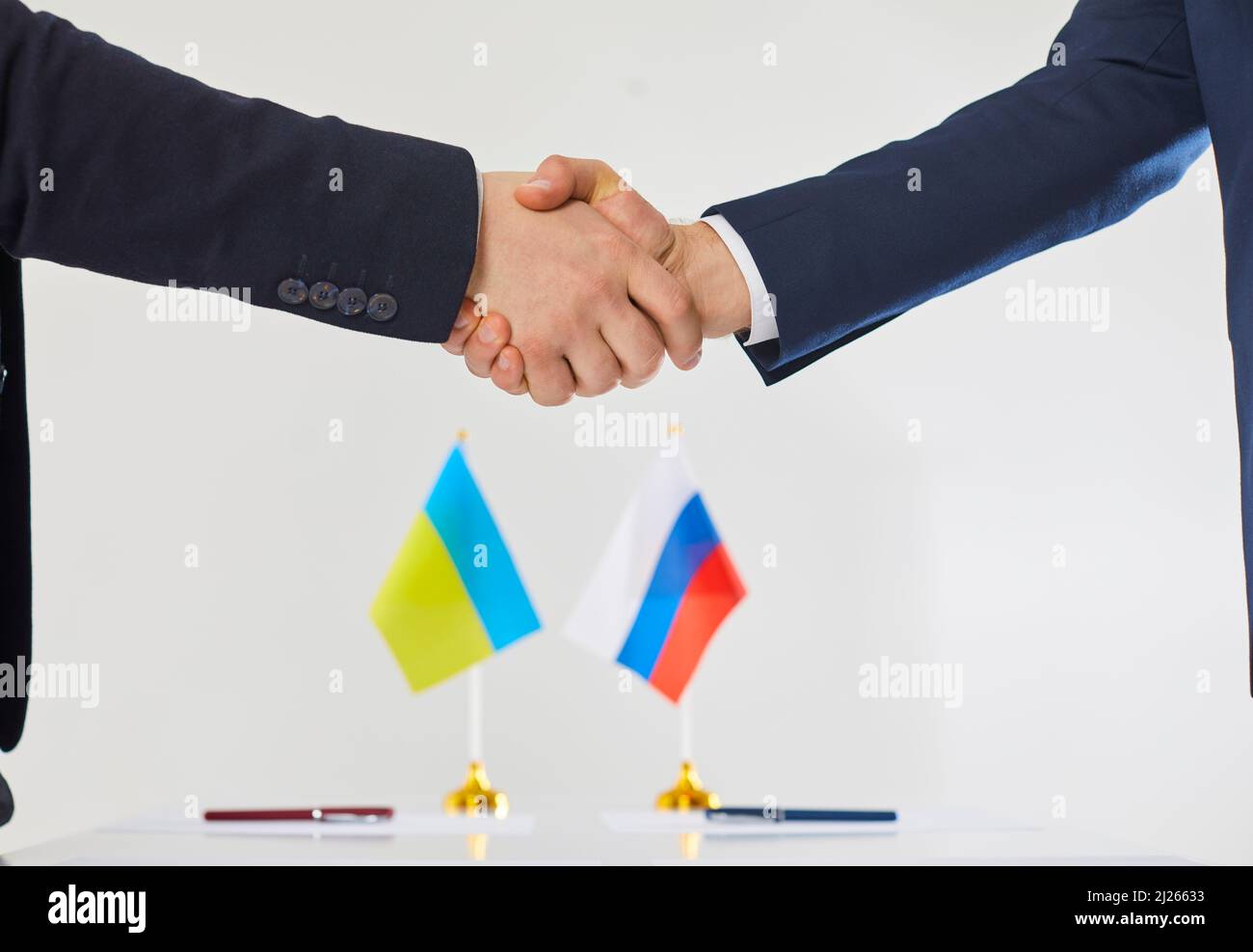 Ukrainian and russian diplomats shake hands Stock Photo