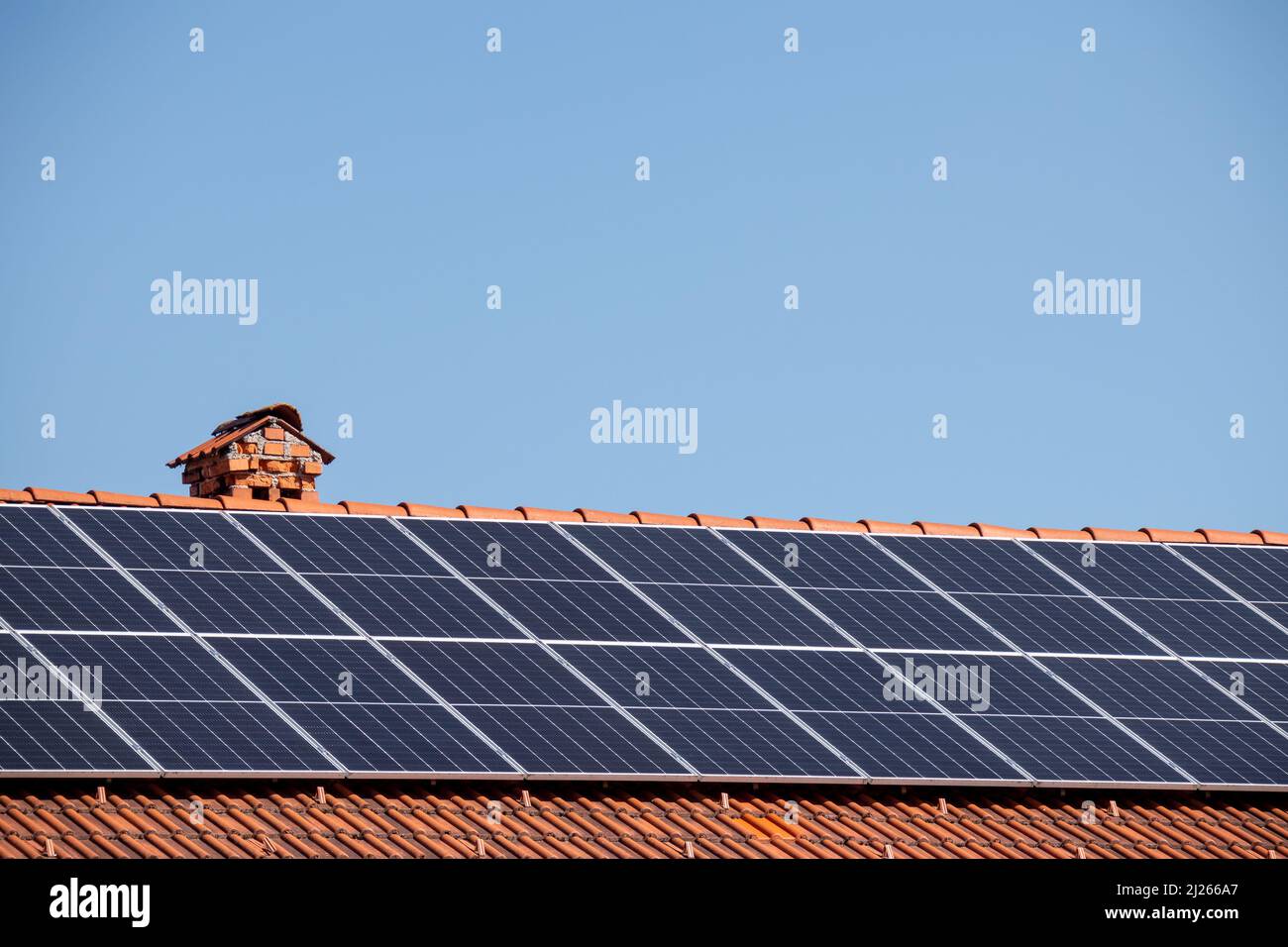 Solar photovoltaic panels on a house roof for renewable energy with ...