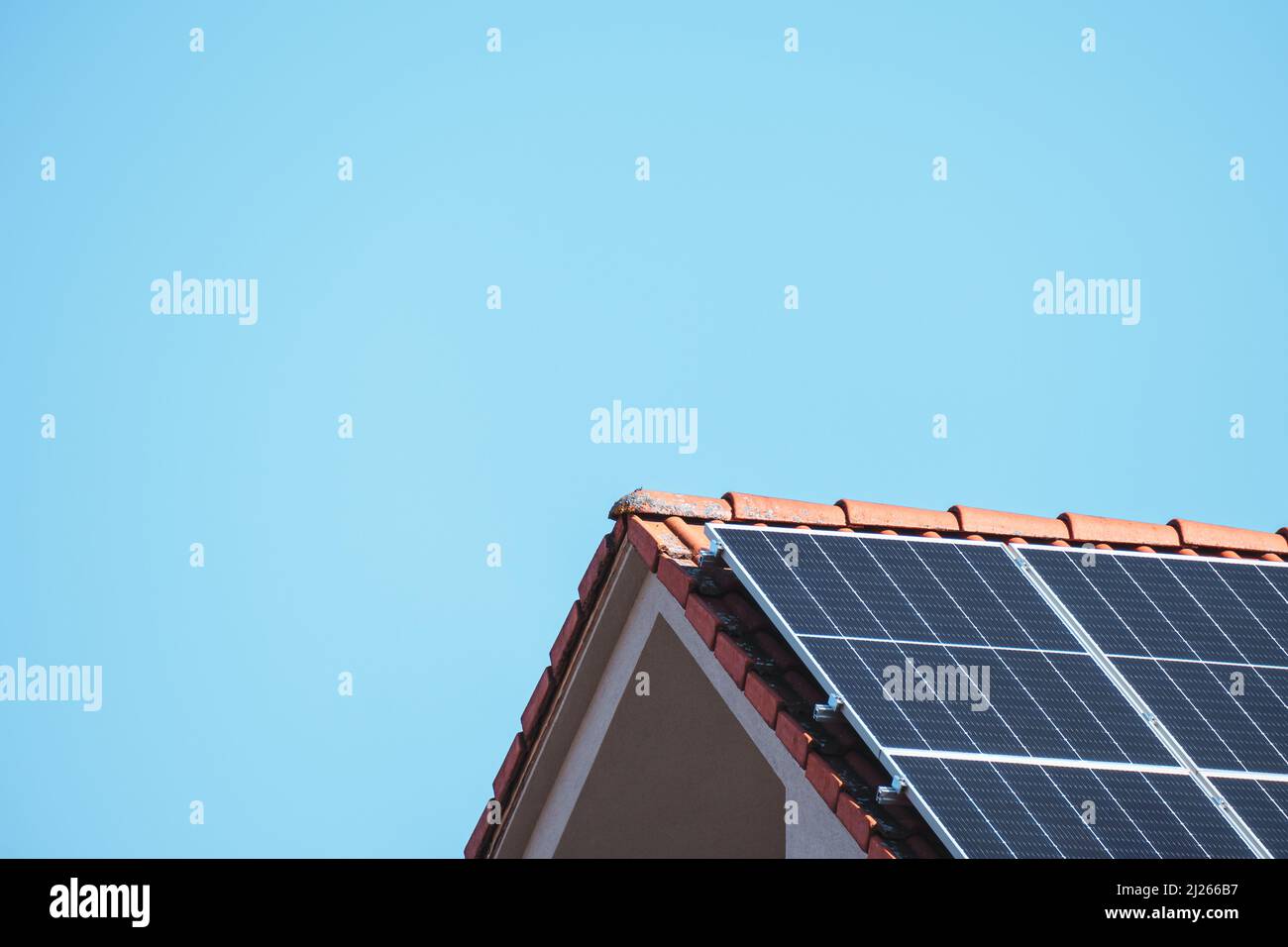 Solar photovoltaic panels on a house roof for renewable energy with ...