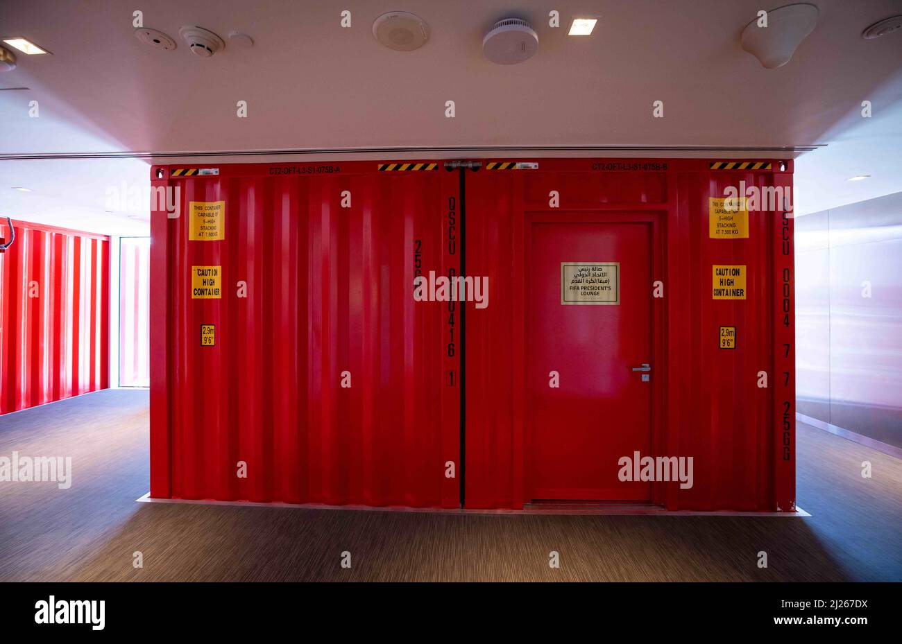 30 March 2022, Qatar, Doha: A sign reading 'FIFA President's Lounge' is seen on the door to the lounge in a shipping container at Stadium 974 during a Fifa media tour. 974 colorfully arranged shipping containers were used to build the stadium. Doha will host the Fifa Congress on March 31 and the draw for the 2022 World Cup in Qatar on April 1. Photo: Christian Charisius/dpa Stock Photo