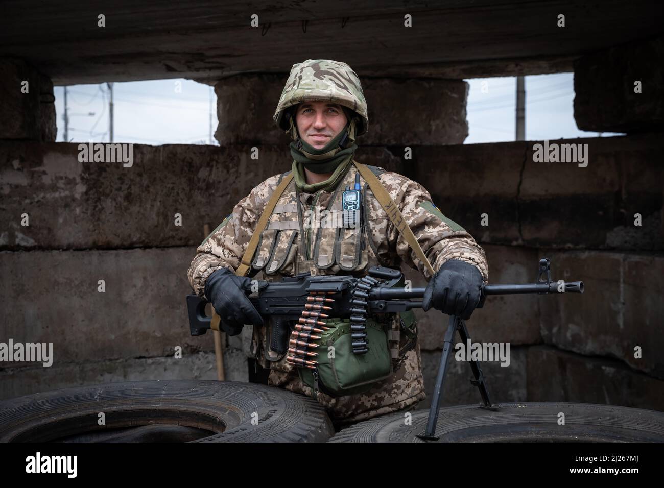 Ukrainian army soldier posing with a heavy machine gun at one of the ...