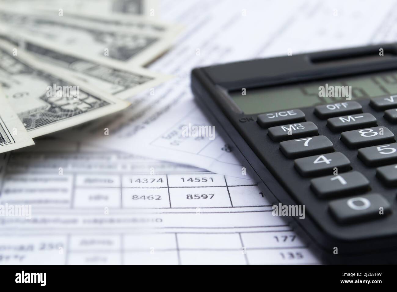 Calculator, money and different bills close-up. Business, household and home budget concept Stock Photo