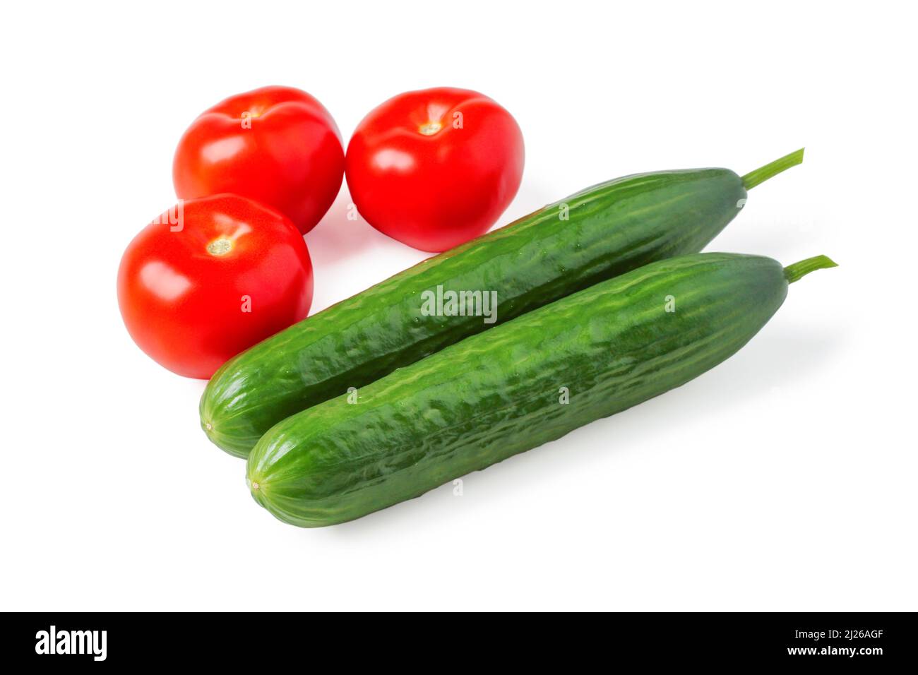 Ripe tomatoes and cucumbers isolated on white Stock Photo