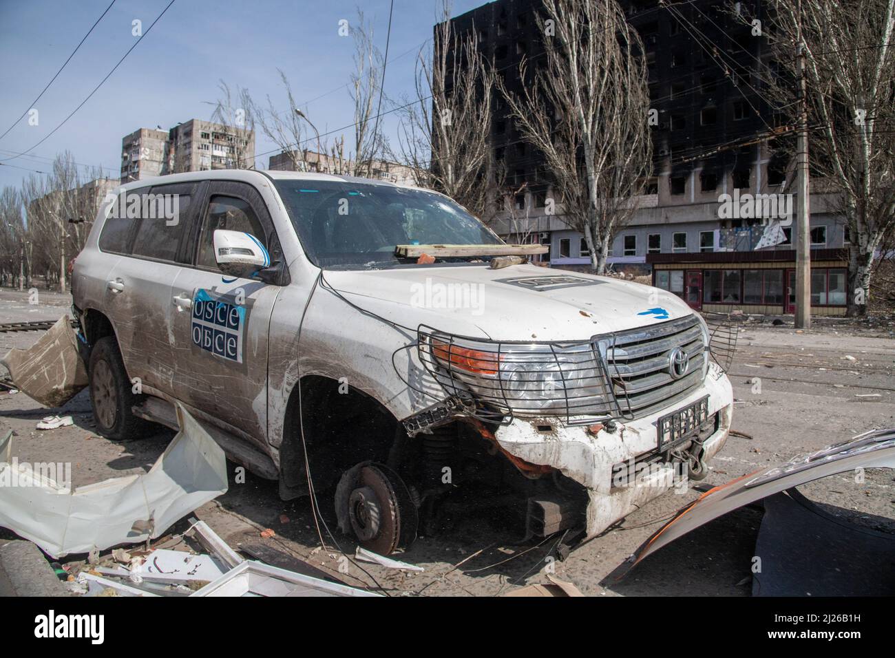A destroyed OSCE Special Monitoring Mission to Ukraine (SMM) vehicle in Mariupol. The battle between Russian / Pro Russian forces and the defencing Ukrainian forces lead by Azov battalion continues in the port city of Mariupol. Stock Photo