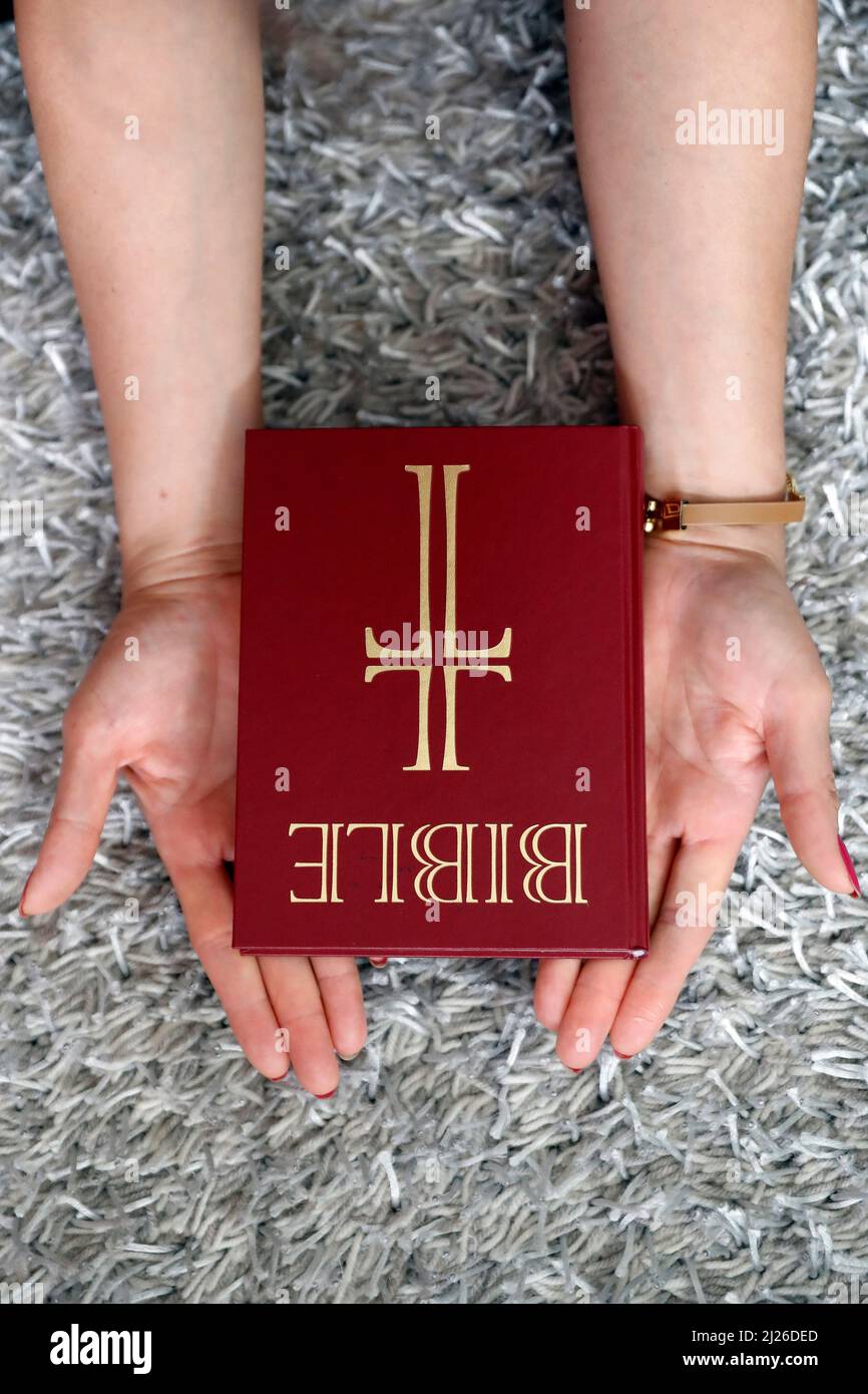 Woman Praying The Bible Close up On Hands Faith And Religion Stock Woman praying the bible close up on hands faith and religion stock