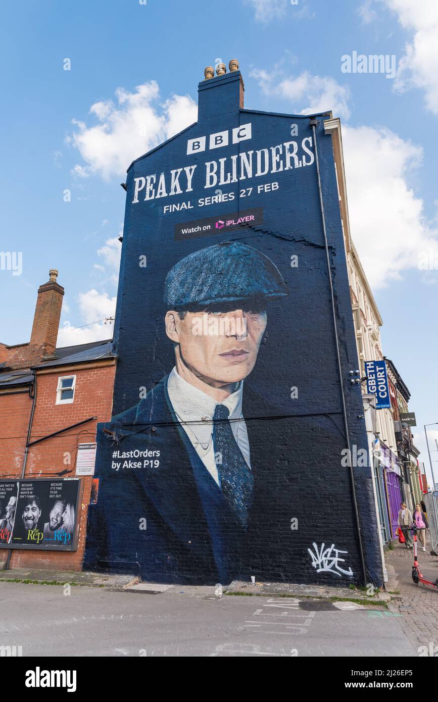 Large advert for final BBC series of Peaky Blinders featuring Cillian Murphy as Tommy Shelby painted on the wall of a building in Digbeth, Birmingham Stock Photo