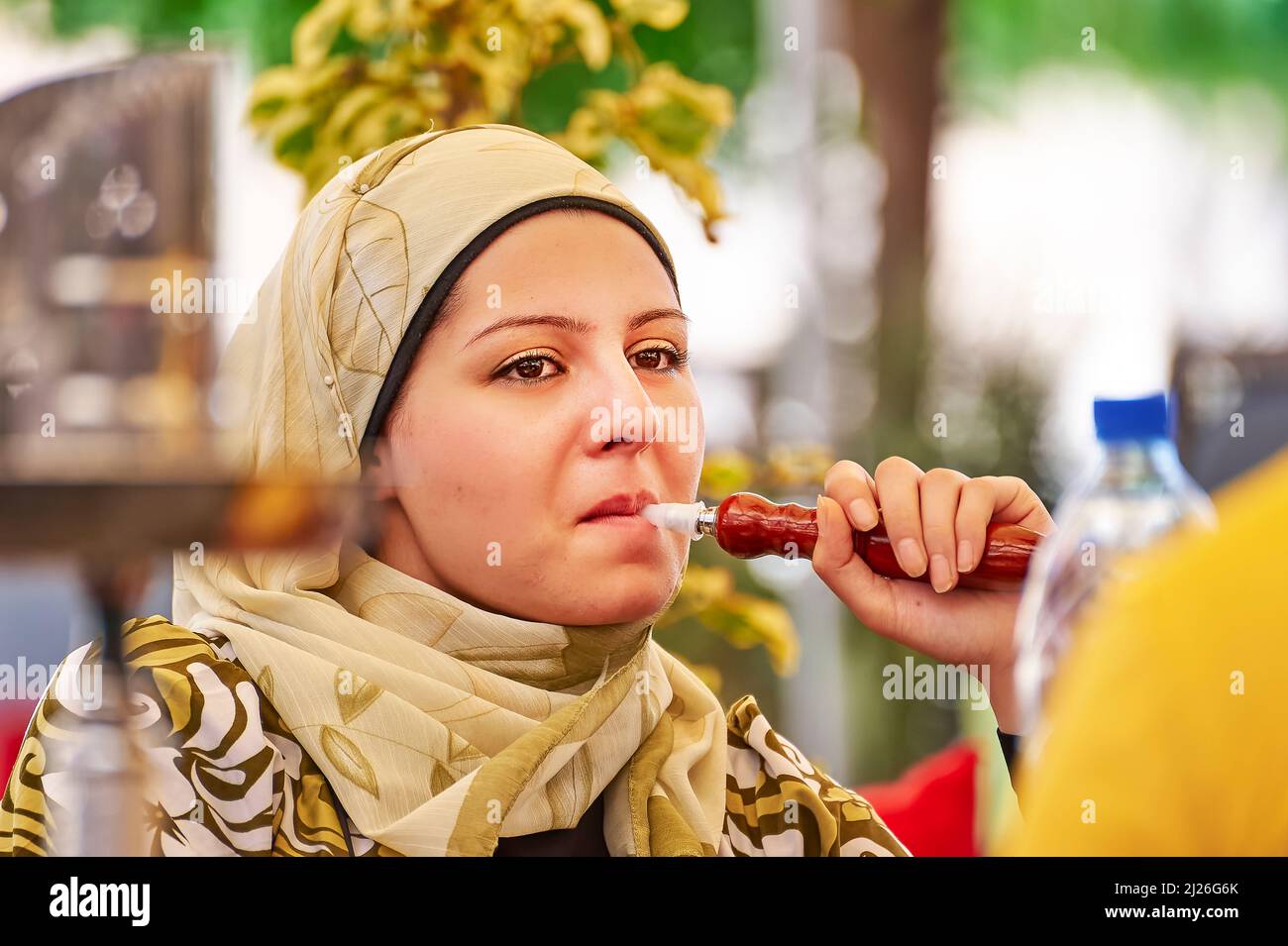 Syria. Aleppo. Girl smoking hookah Stock Photo