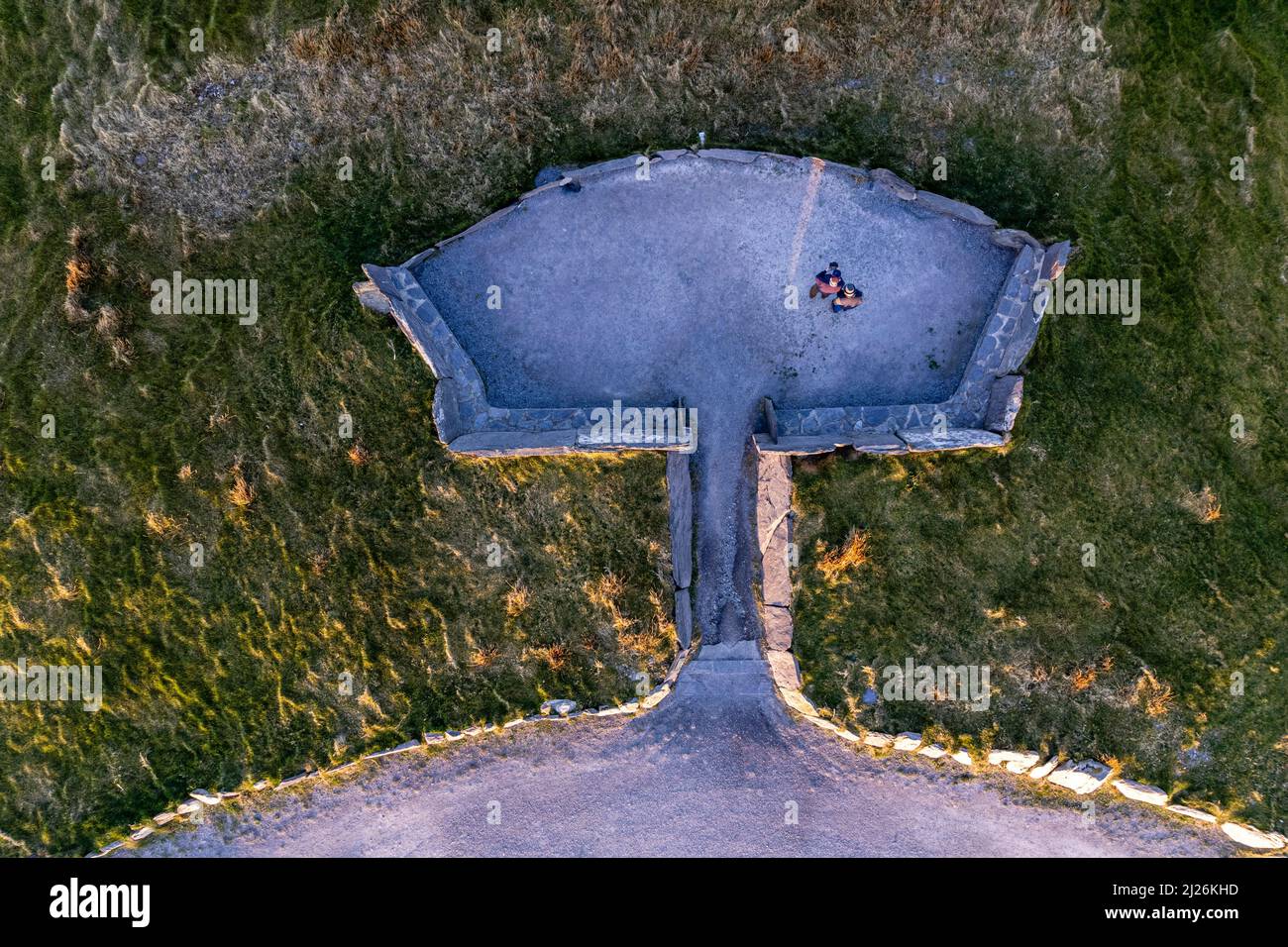 Overhead drone shot of two people in Car Park on Geokauan Mountain Valentia Island County Kerry, Ireland Stock Photo