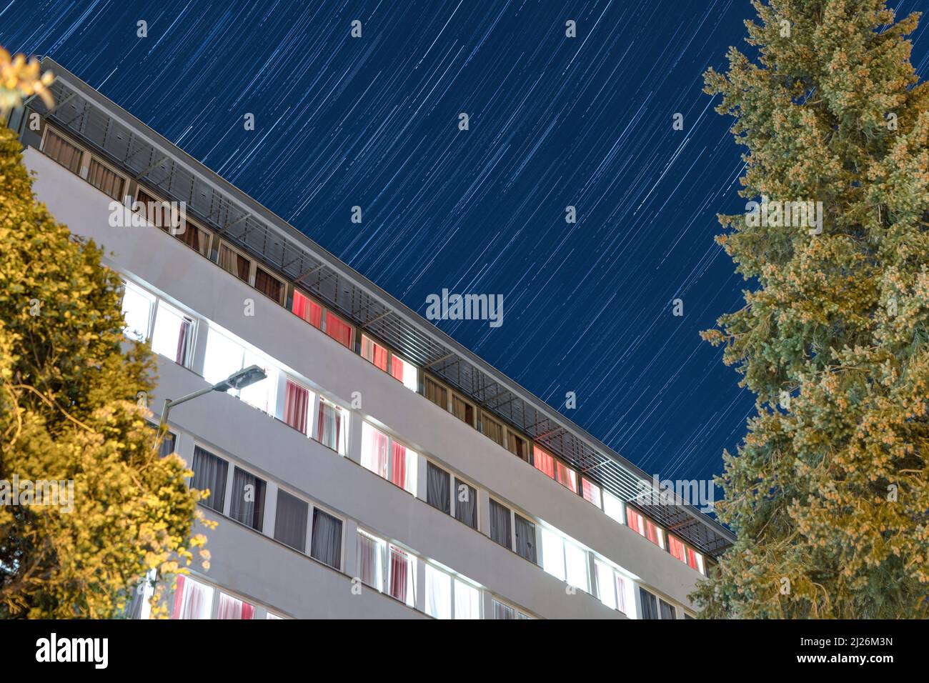 A low angle shot of a modern building at the starry night Stock Photo ...