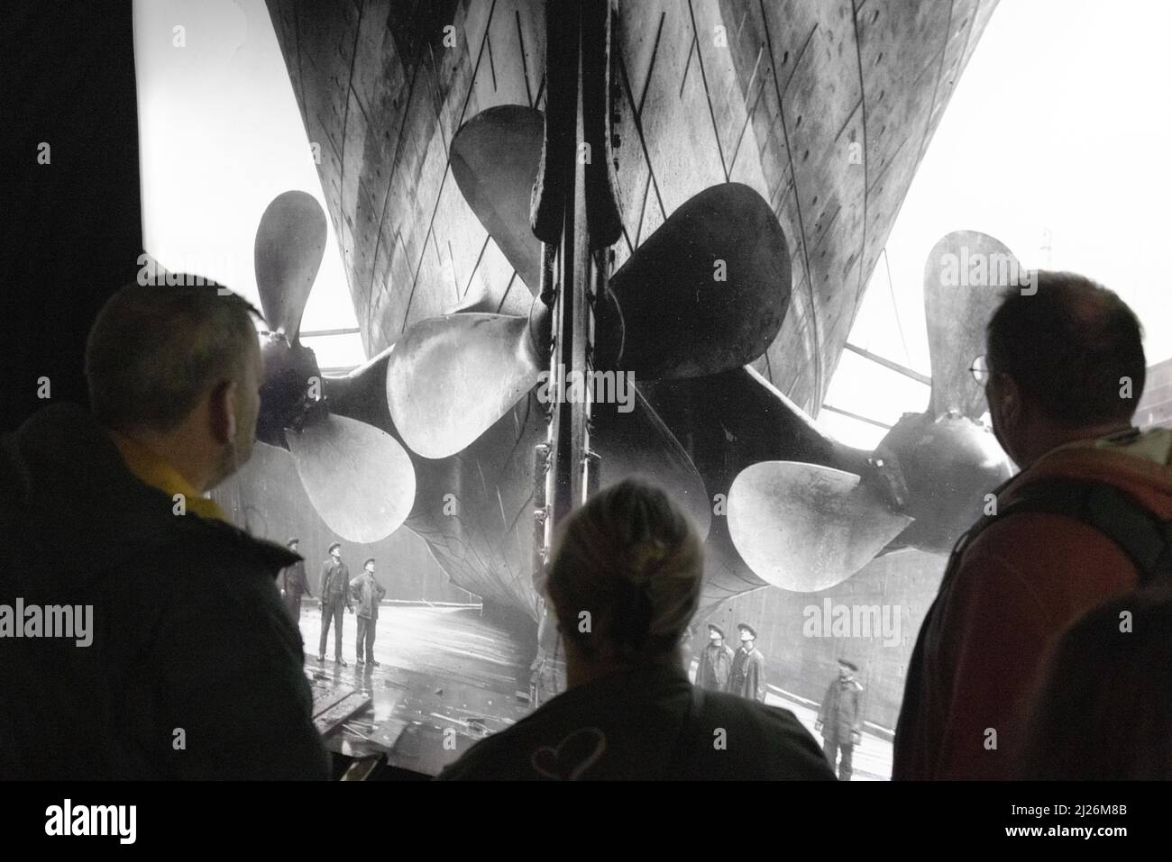The Titanic Exhibition - visitors looking at a photograph of the Titanic ship propellers, London UK Stock Photo