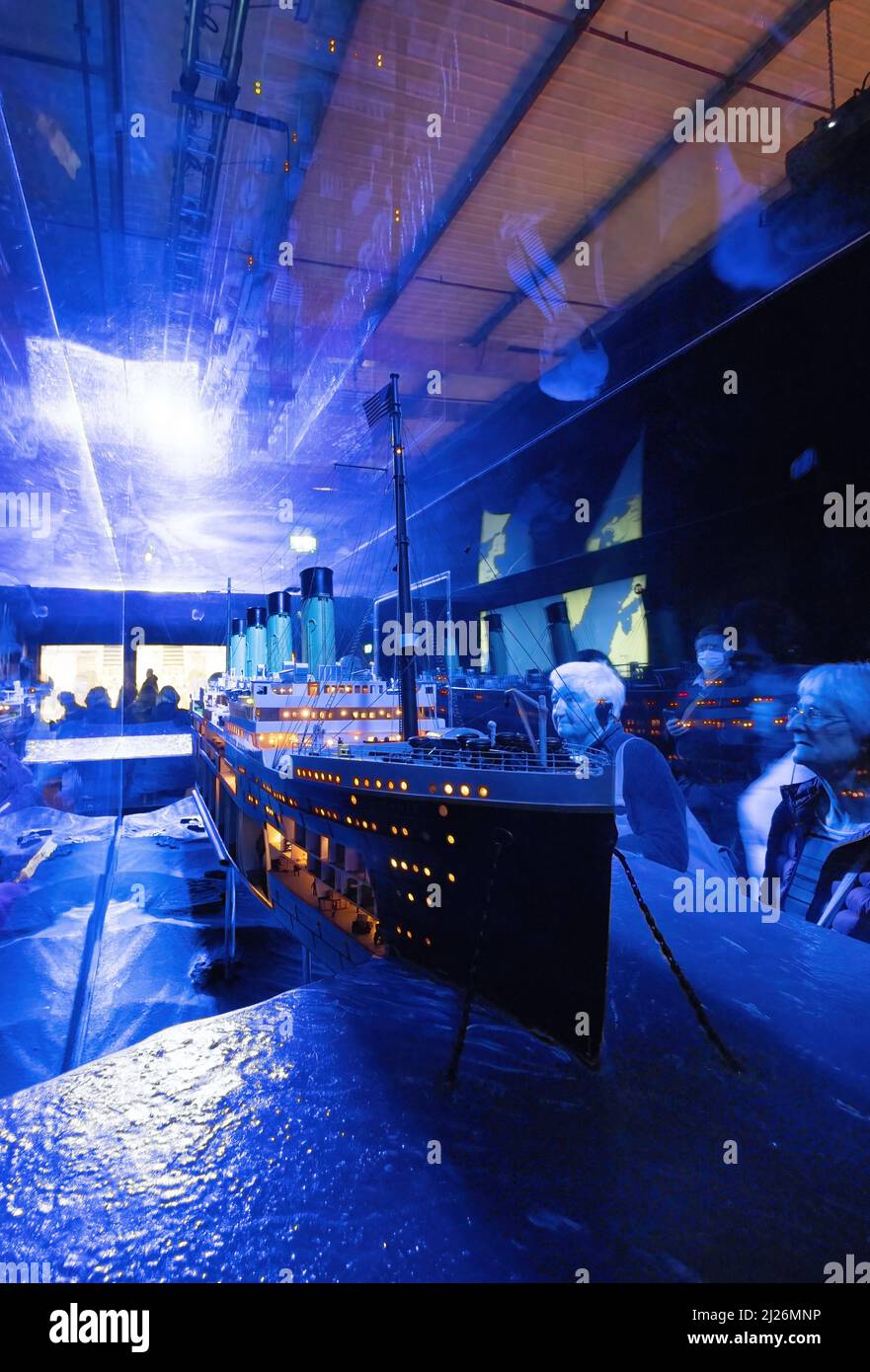 The Titanic sinking - people looking at a Titanic ship model, The Titanic Exhibition, London UK Stock Photo