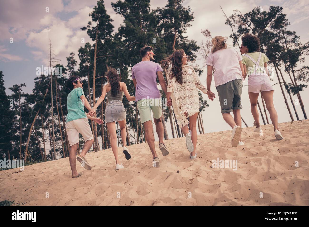 Back rear view full size photo of young best friends have fun hold ...