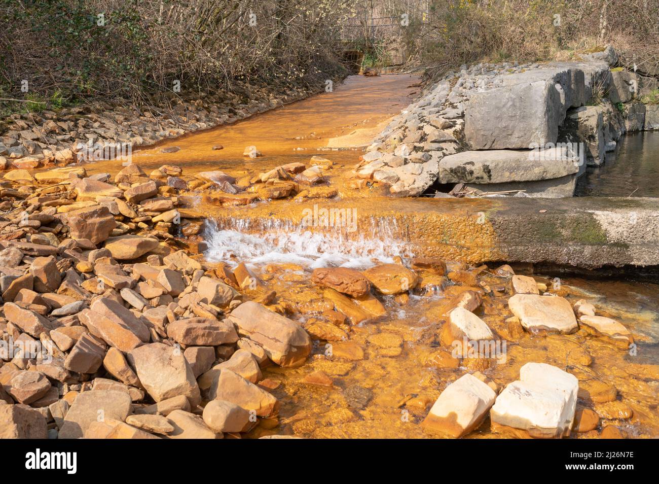 Orange iron oxide staining in stream entering River Neath at Abergarwed