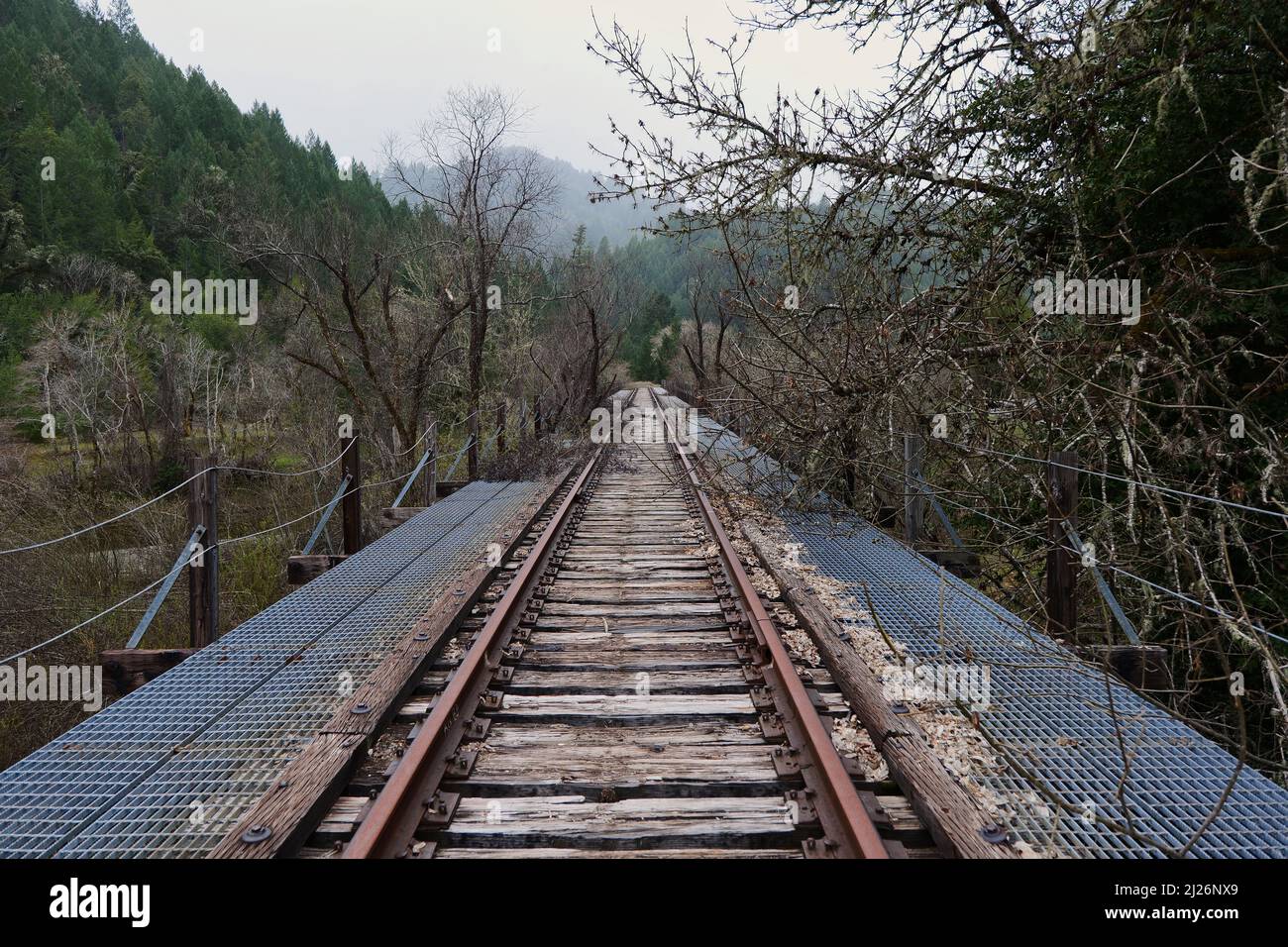 The old abandoned train tracks on bridge near Willits, CA Stock Photo