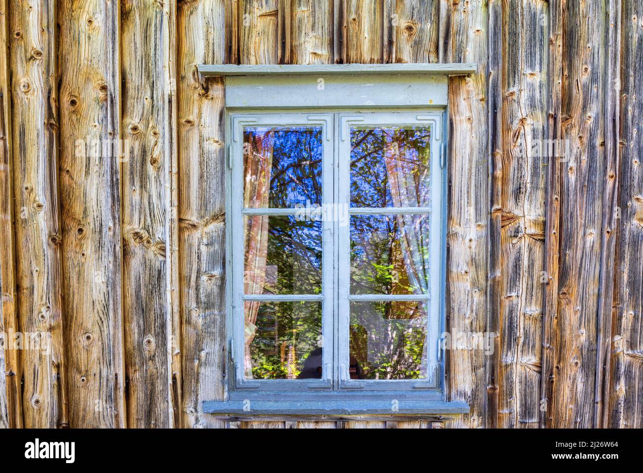 Window on an old unpainted wooden wall Stock Photo - Alamy