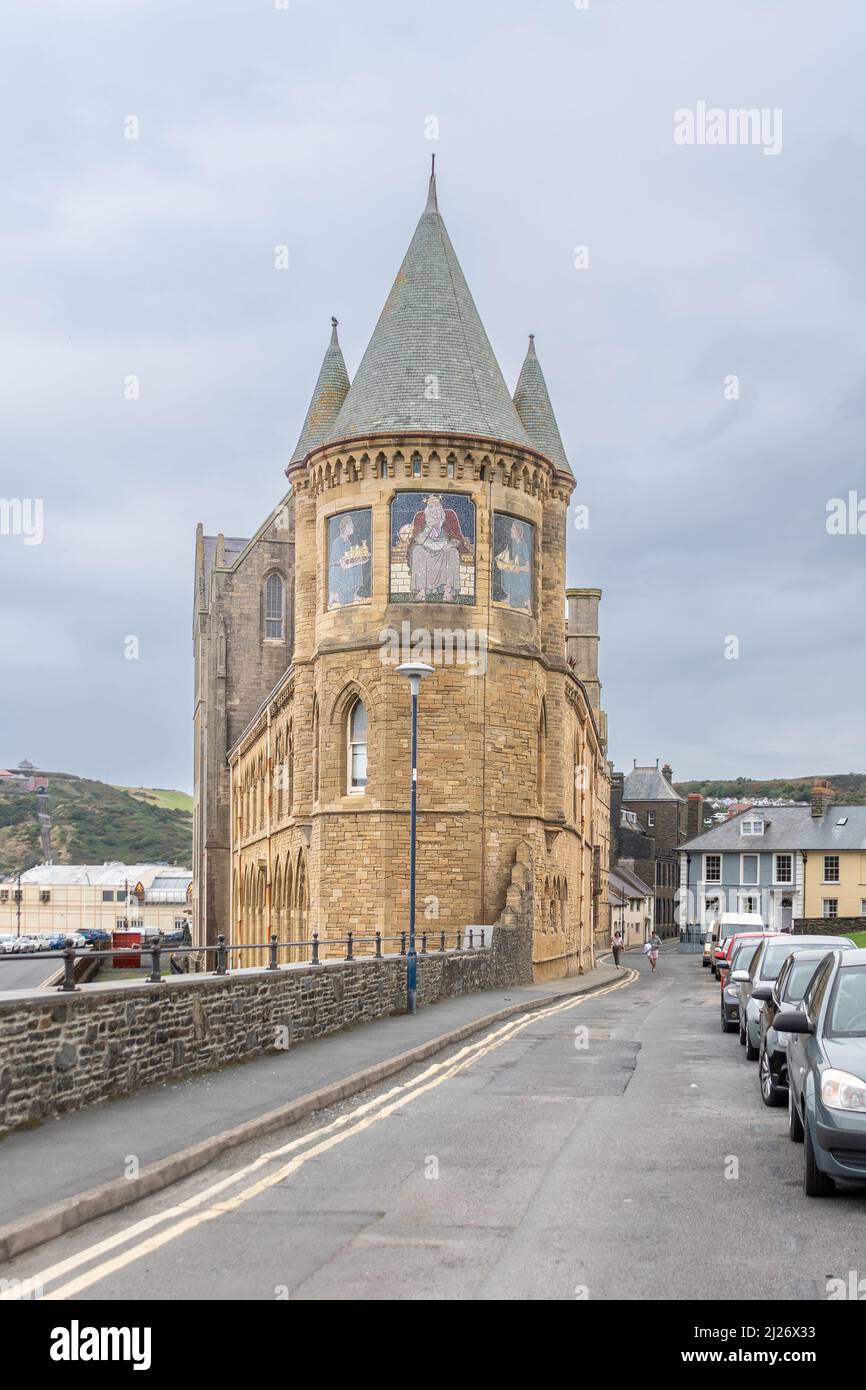 A portrait orientation view of the Aberystwyth Old College south tower with mosaics representing Archimedes receiving the emblems of modern science an Stock Photo