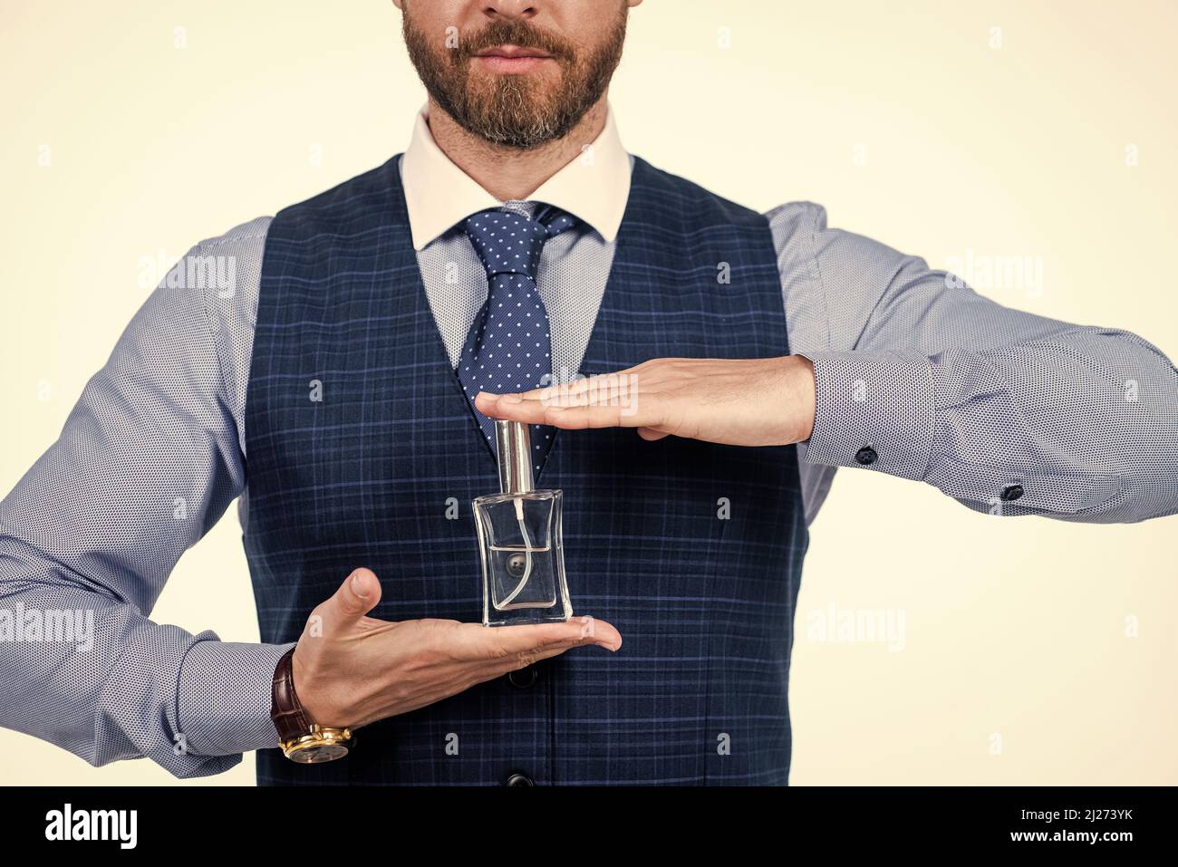 cropped man hold male perfume bottle, cologne Stock Photo