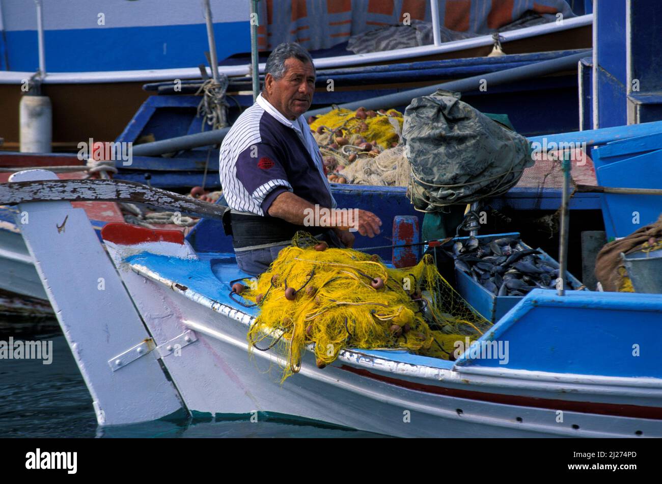 Pigadia,fisher on his boat,  Karpathos island, Dodecanese, Greece, Europe Stock Photo