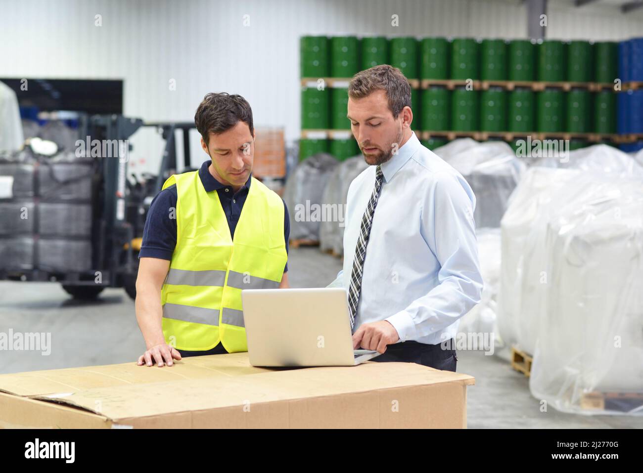 group of manager and worker in the logistics industry work in a warehouse with chemicals Stock Photo